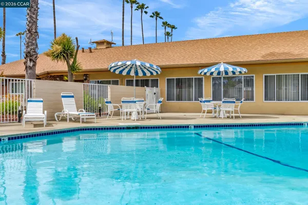 a kitchen with stainless steel appliances a refrigerator sink and cabinets