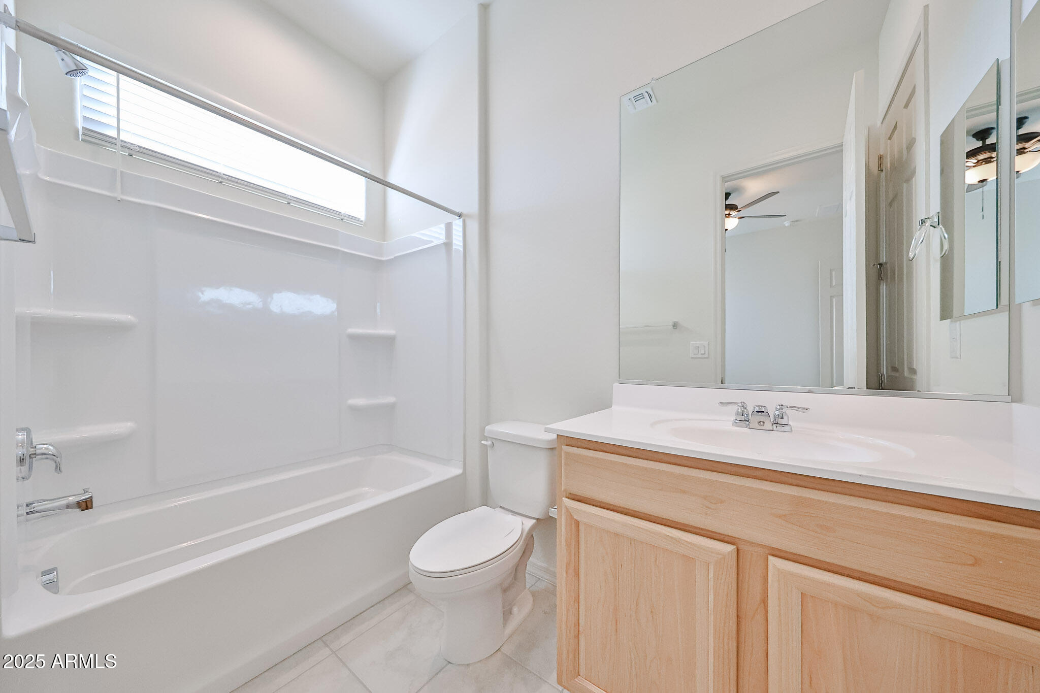25079 North 171st Avenue Surprise, AZ 85387 - Photo 18 of 22 a bathroom with a sink a toilet and a bathtub