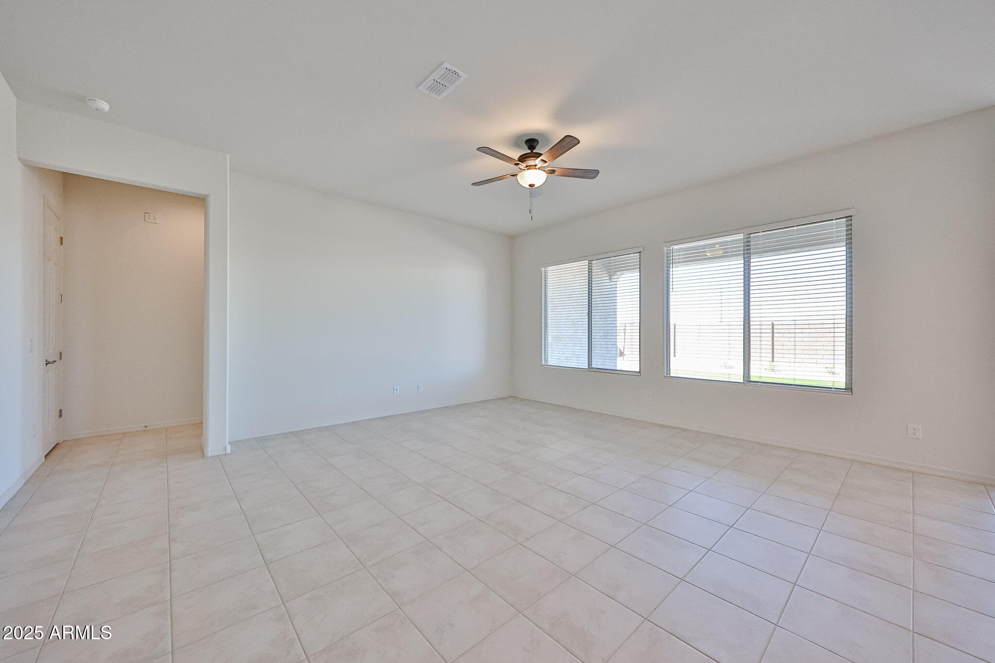 25079 North 171st Avenue Surprise, AZ 85387 - Photo 6 of 22 a view of an empty room with a window