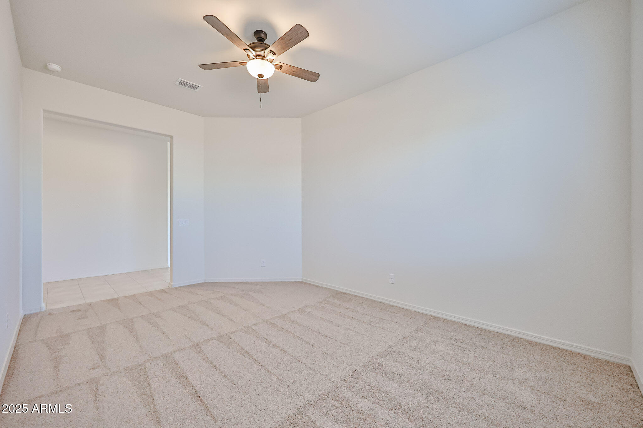 25079 North 171st Avenue Surprise, AZ 85387 - Photo 8 of 22 a view of an empty room