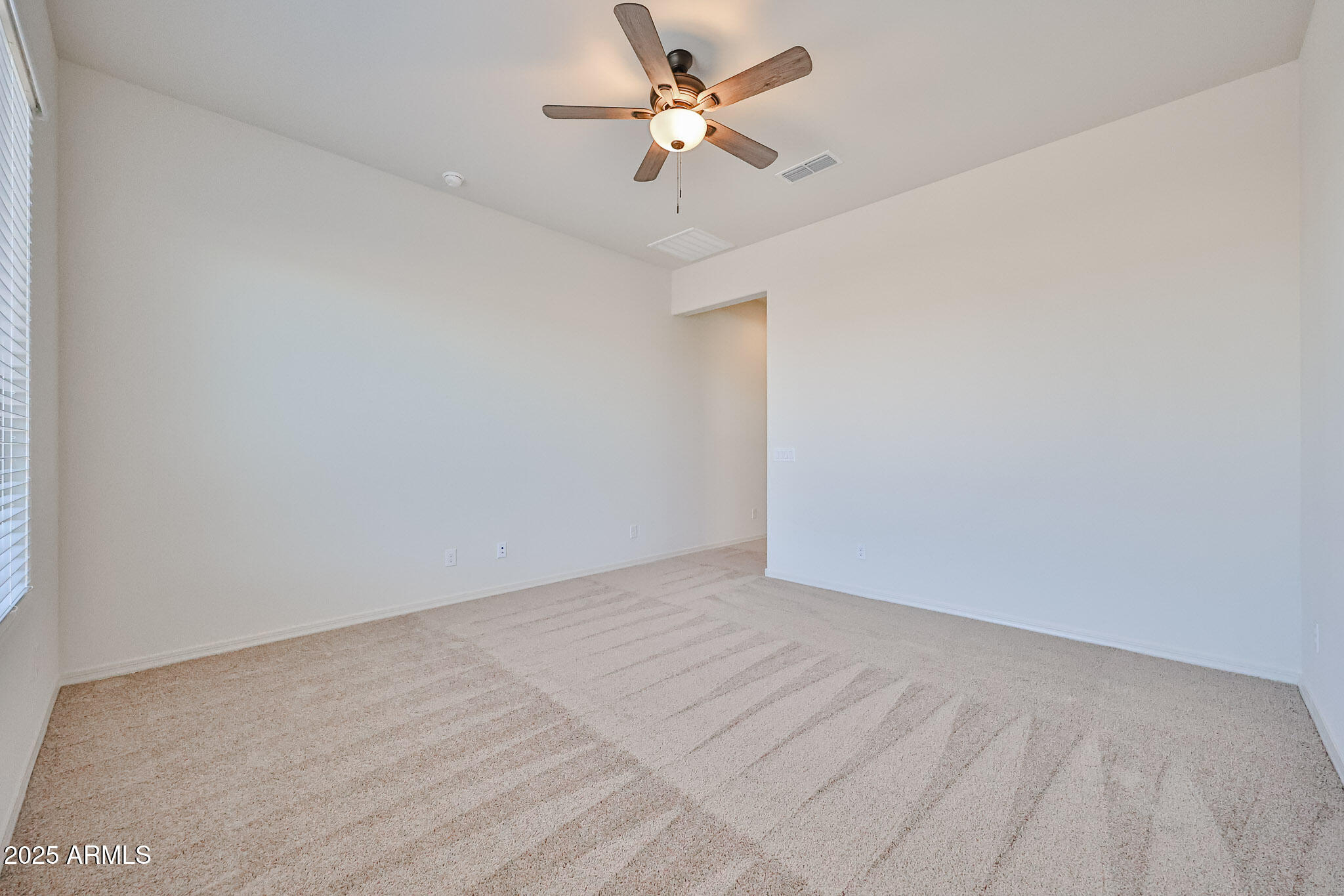 25079 North 171st Avenue Surprise, AZ 85387 - Photo 9 of 22 a view of an empty room
