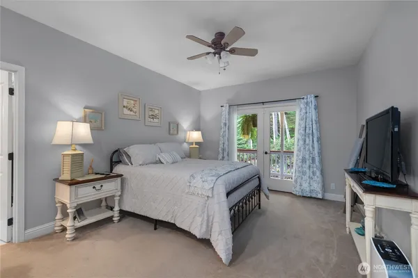 a bed room with a bed and a television