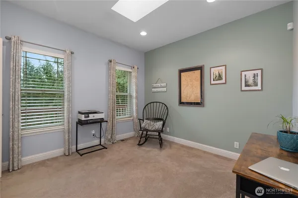 a workspace with furniture and a window