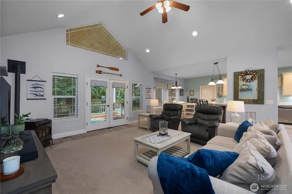 a living room with furniture fireplace and flat screen tv