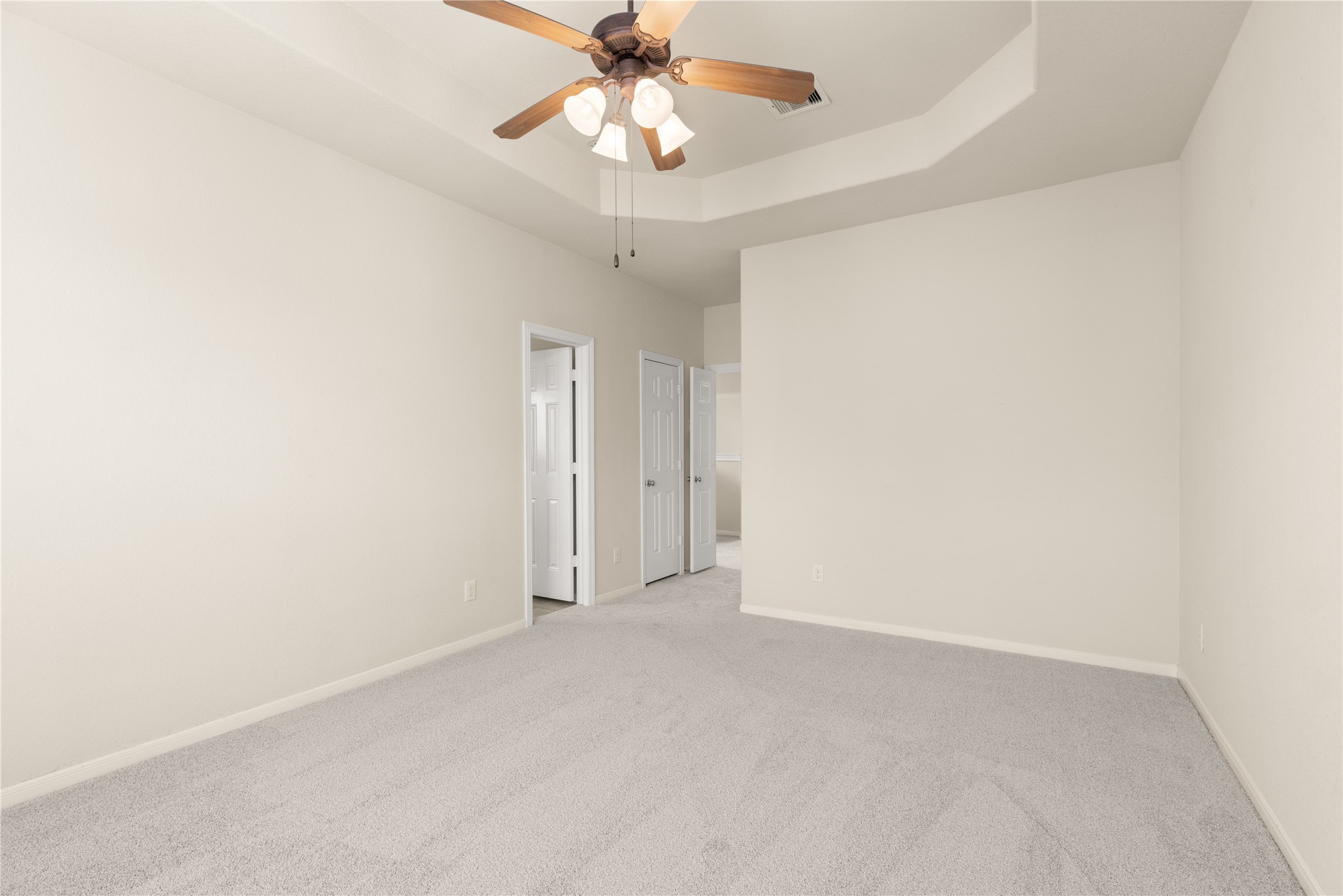 3334 Clearview Villa Way Houston, TX 77025 - Photo 16 of 35 This room features new neutral carpet and walls, a ceiling fan with lights, and an entrance leading to the Primary sitting area.