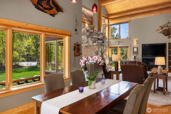 a view of a dining room with furniture window and outside view