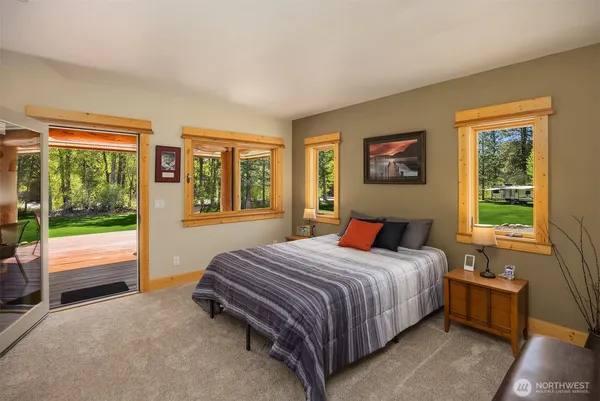 a bedroom with a bed and a couch