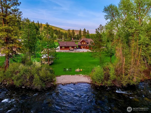a view of a garden with a building in the background