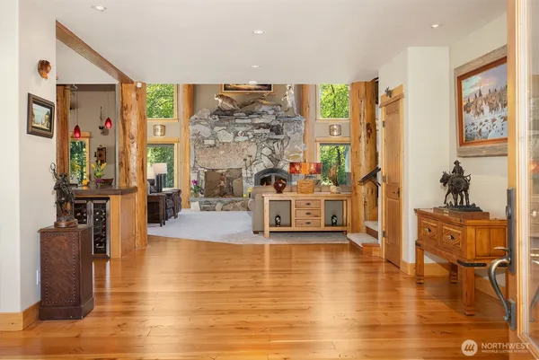a living room with fireplace furniture and a flat screen tv
