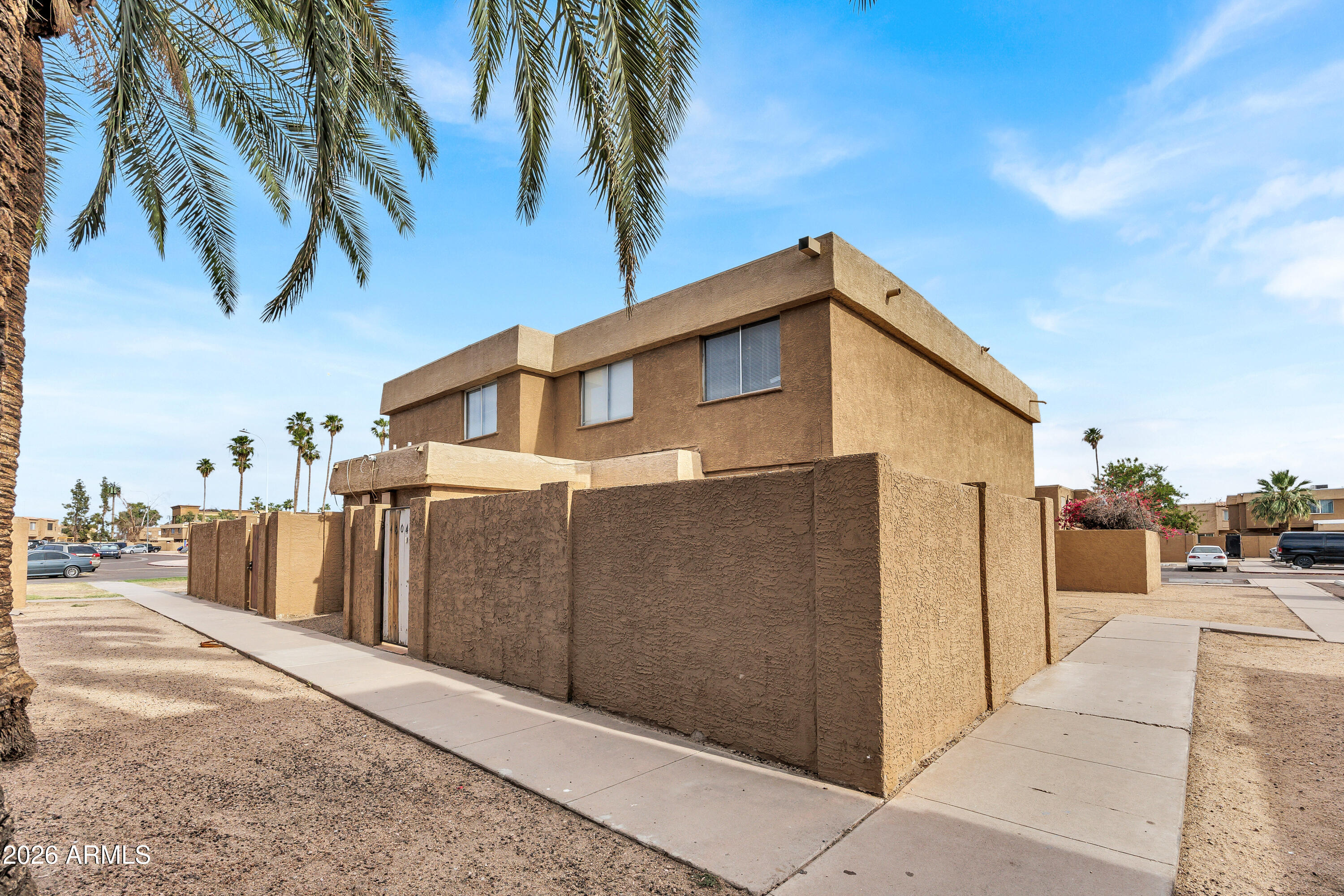 4604 East Riverside Street Phoenix, AZ 85040 - Photo 2 of 24 a view of a house with a backyard