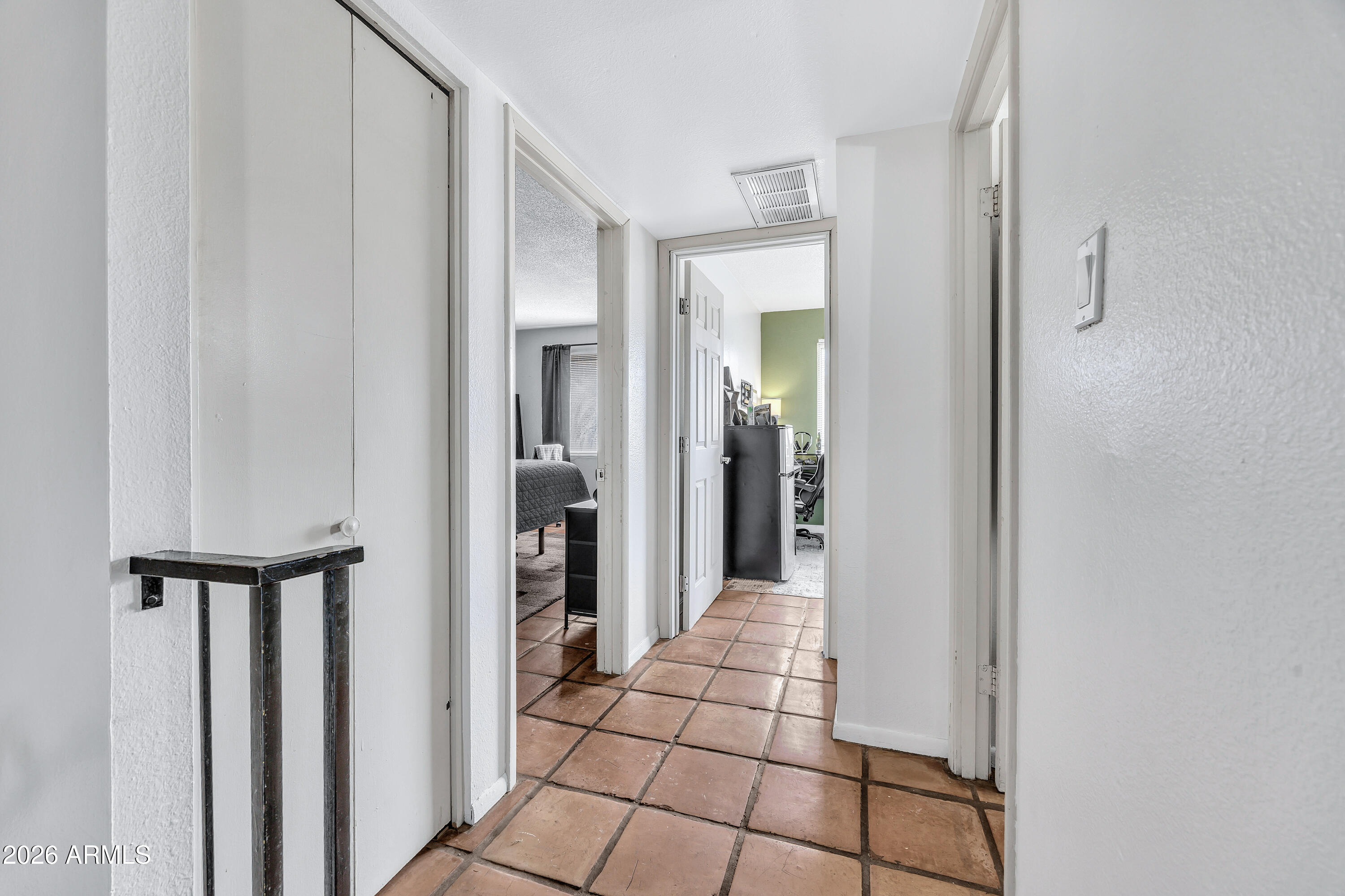 4604 East Riverside Street Phoenix, AZ 85040 - Photo 22 of 24 a view of a hallway with wooden floor and closet