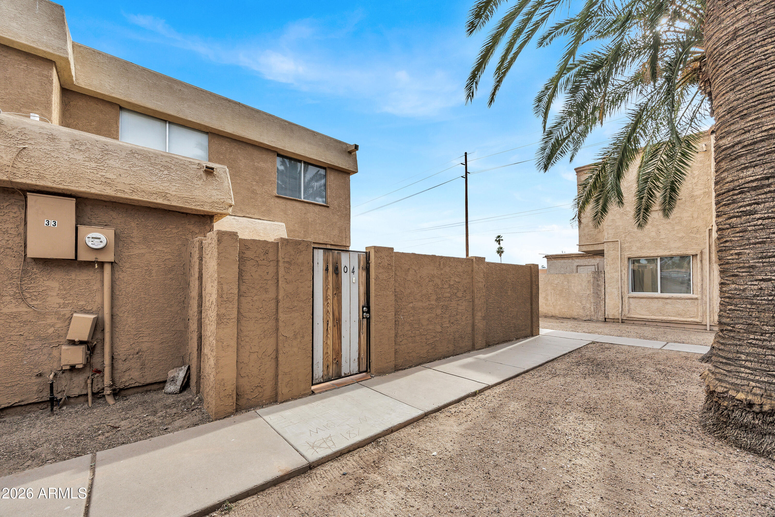 4604 East Riverside Street Phoenix, AZ 85040 - Photo 3 of 24 a view of a parking space in front of a house