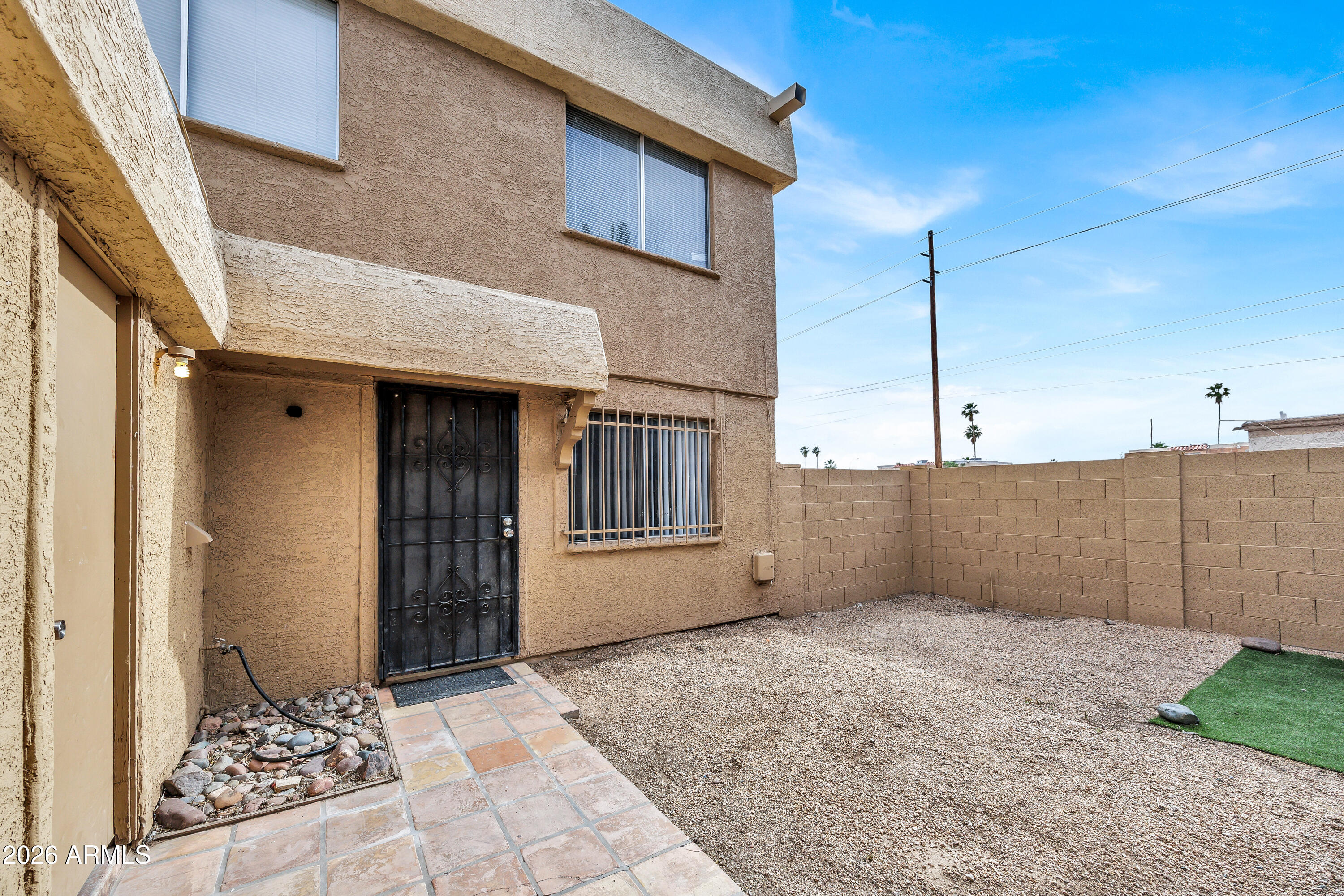 4604 East Riverside Street Phoenix, AZ 85040 - Photo 4 of 24 a view of a house with a backyard