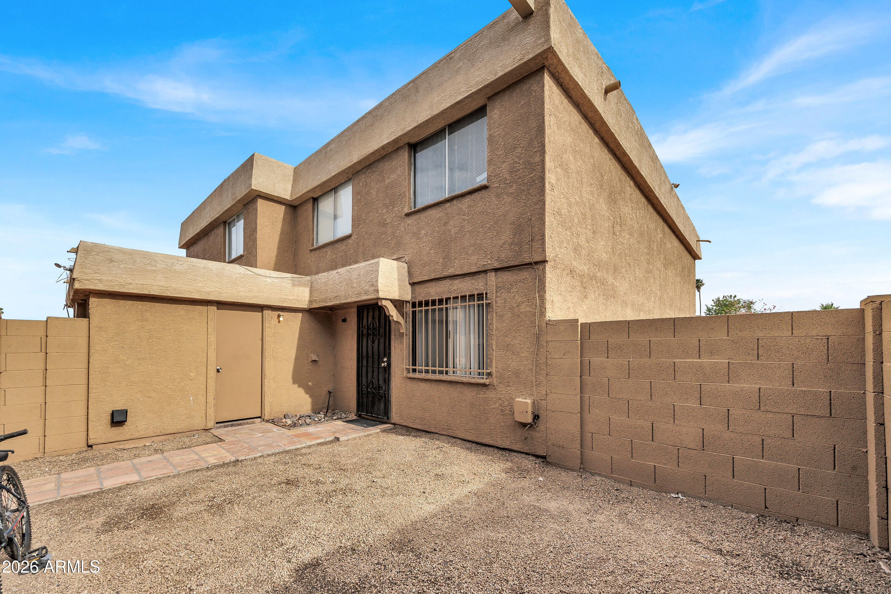 4604 East Riverside Street Phoenix, AZ 85040 - Photo 5 of 24 a view of a house with a backyard