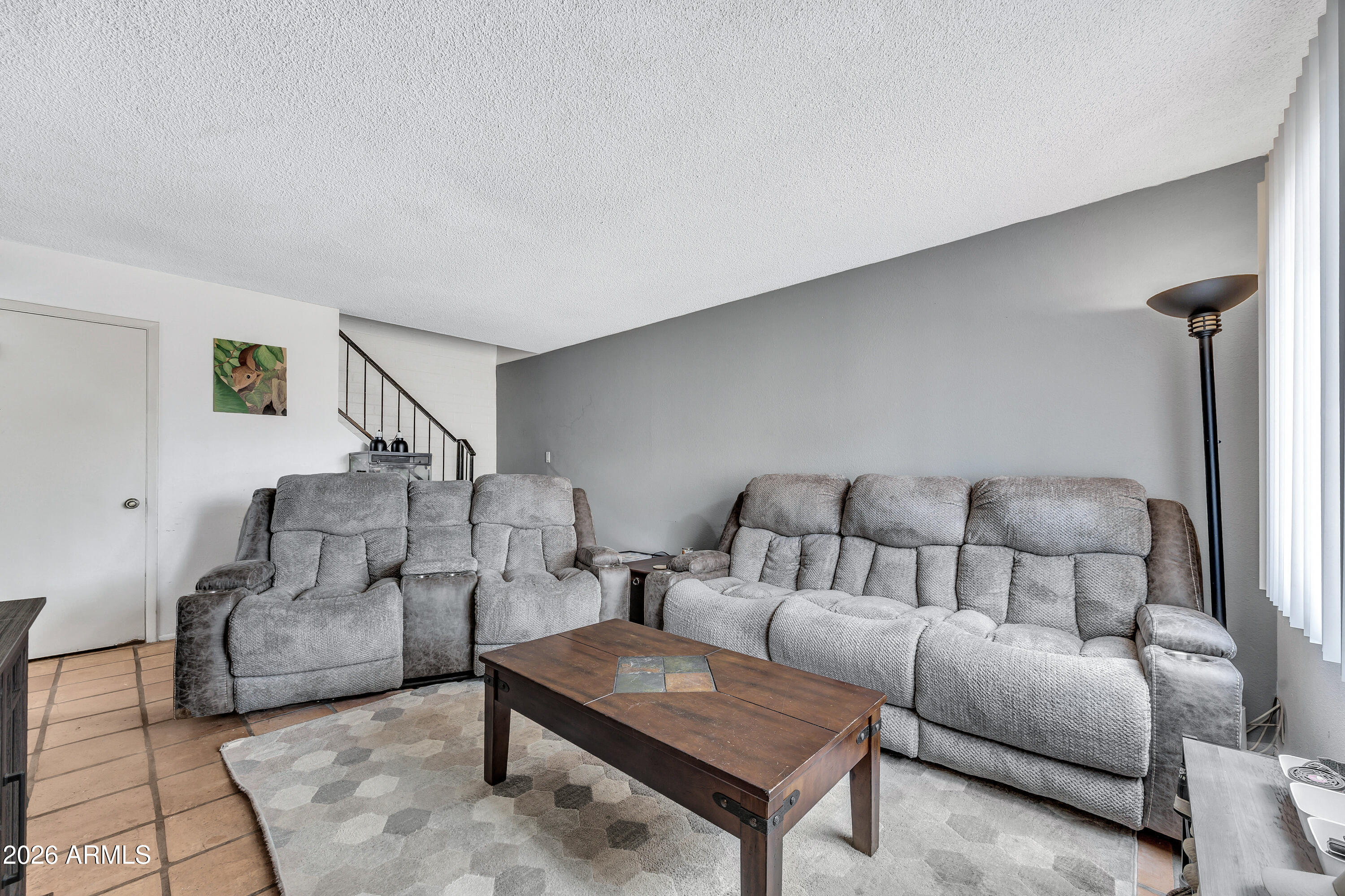 4604 East Riverside Street Phoenix, AZ 85040 - Photo 6 of 24 a living room with furniture and a potted plant