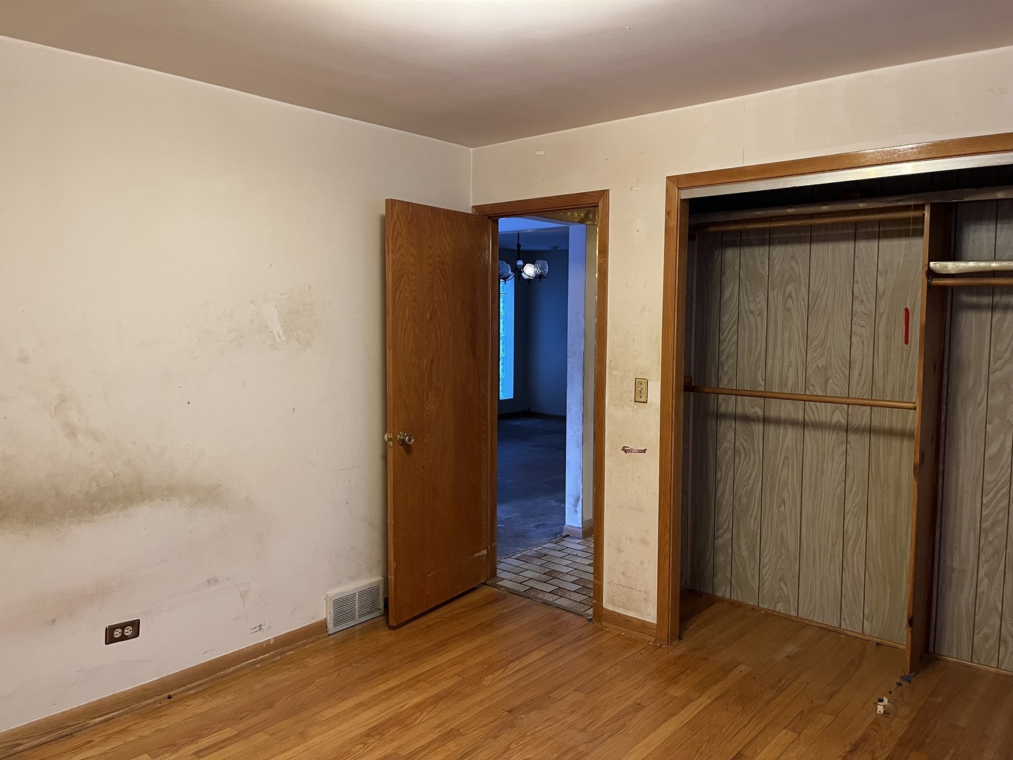 6142 West Barry Avenue Chicago, IL 60634 - Photo 11 of 12 an empty room with wooden floor and closet