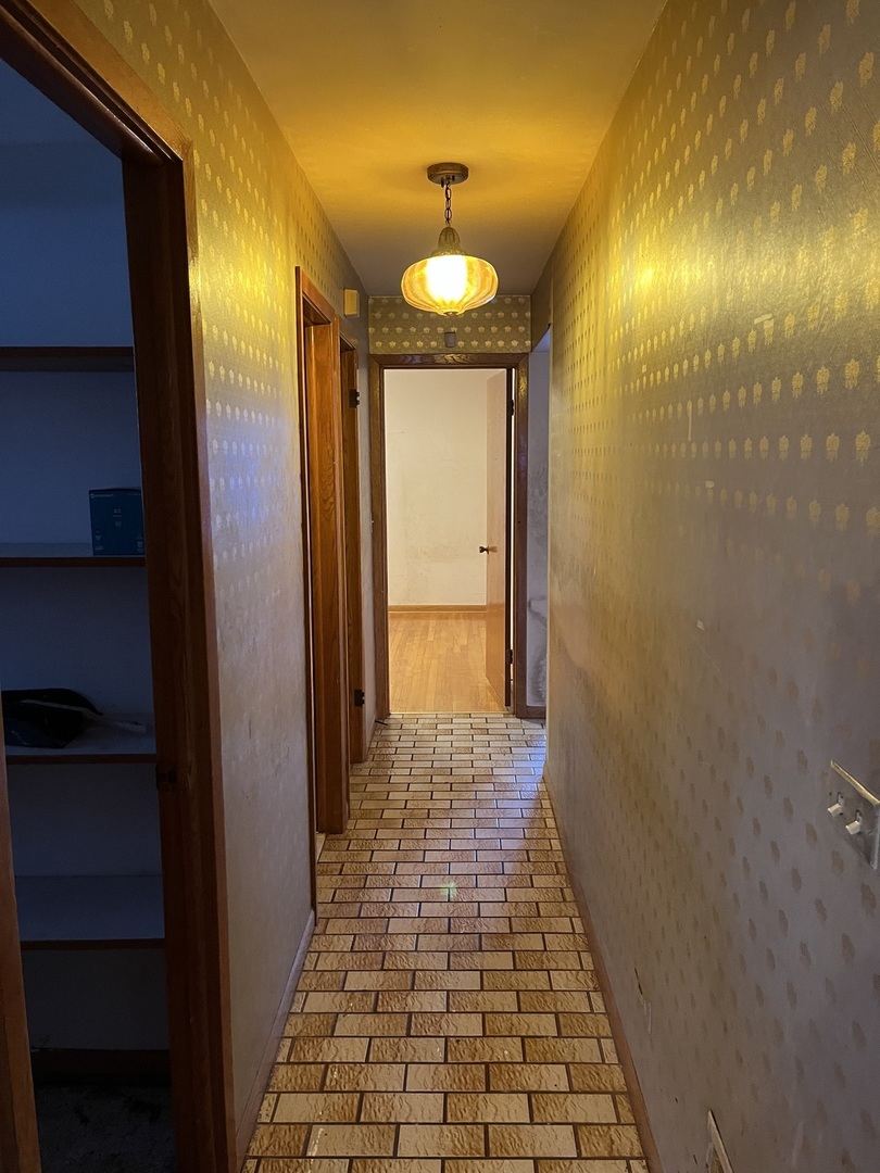 6142 West Barry Avenue Chicago, IL 60634 - Photo 12 of 12 a bathroom with a mirror