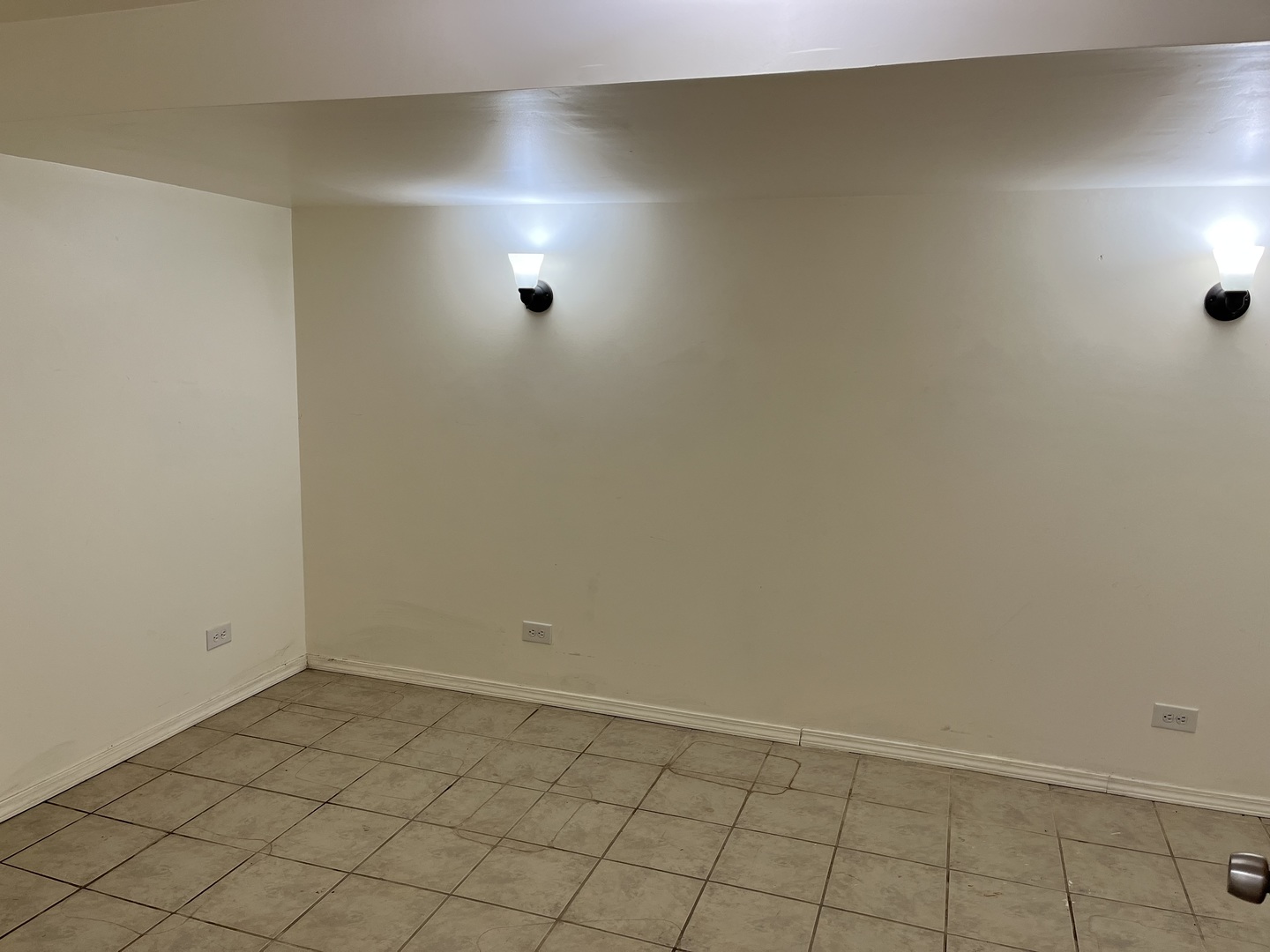 6142 West Barry Avenue Chicago, IL 60634 - Photo 9 of 12 an empty room with white walls and tiles