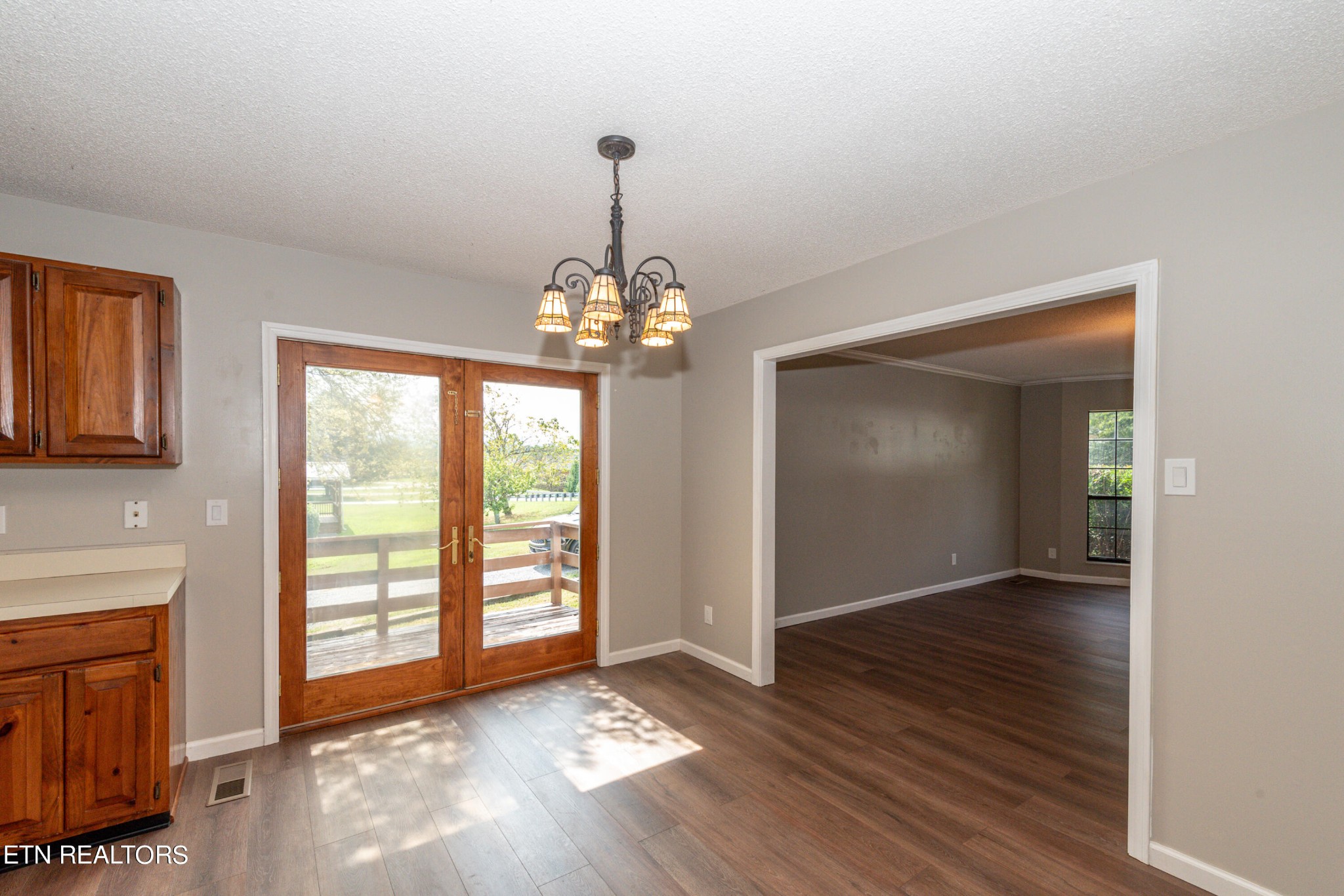 1318 Raulston Road Maryville, TN 37803 - Photo 13 of 28 a view of an empty room with wooden floor and a window