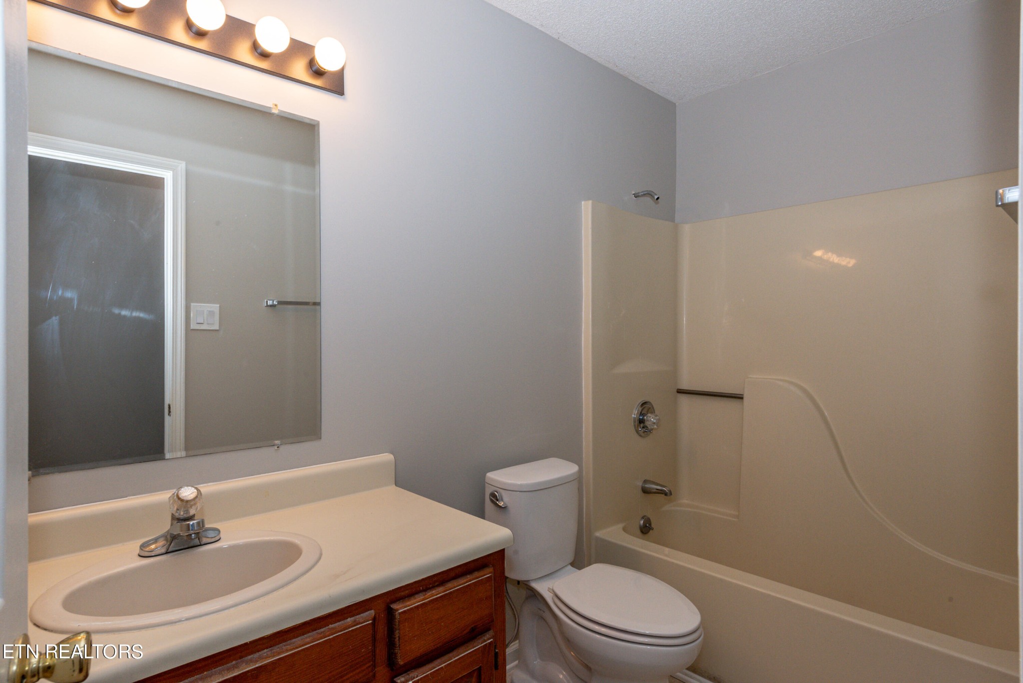 1318 Raulston Road Maryville, TN 37803 - Photo 20 of 28 a bathroom with a sink toilet and shower