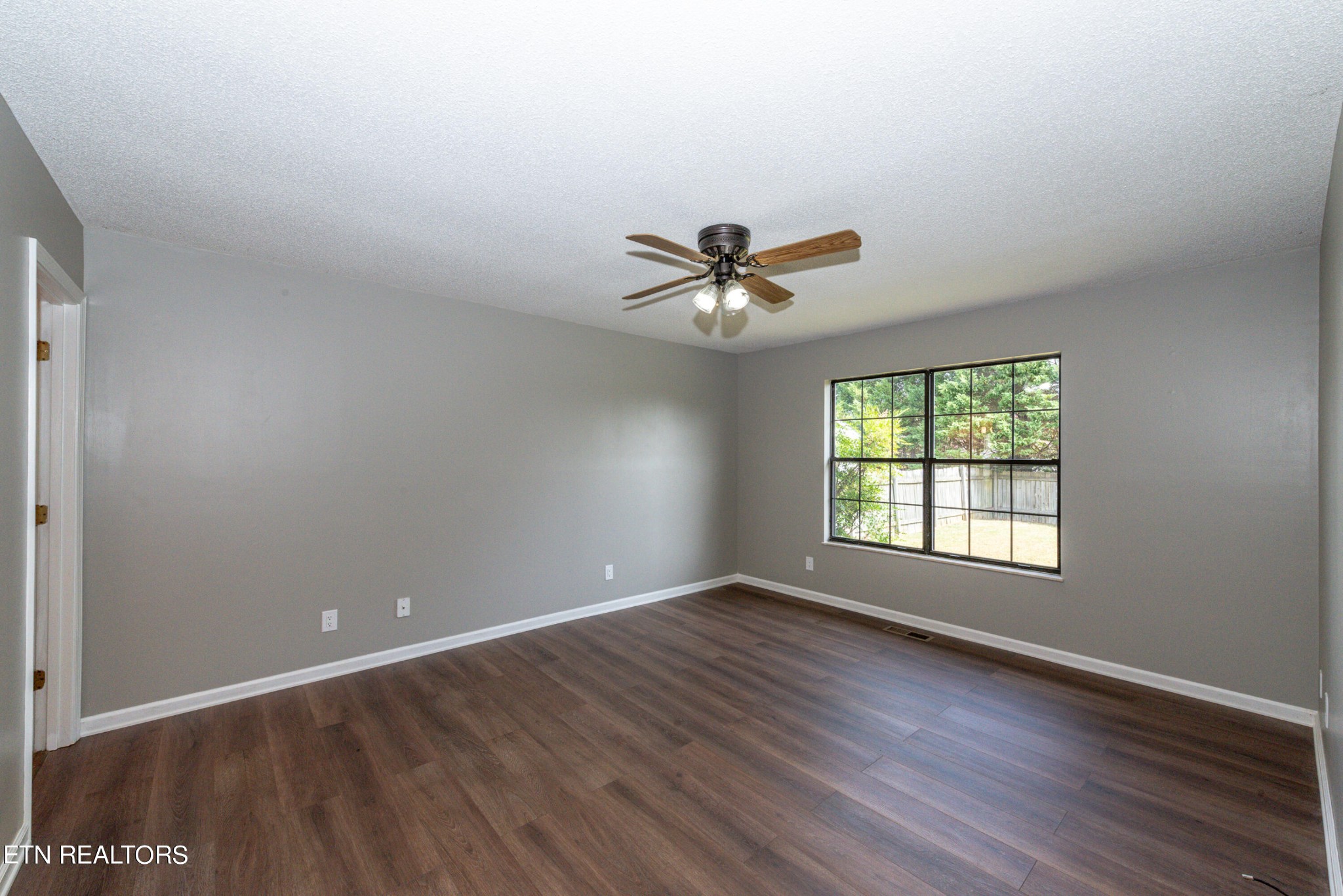 1318 Raulston Road Maryville, TN 37803 - Photo 21 of 28 a view of an empty room with a window and wooden floor