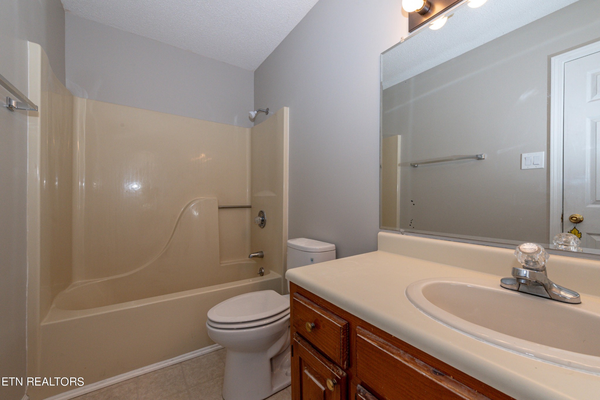 1318 Raulston Road Maryville, TN 37803 - Photo 25 of 28 a bathroom with a sink a toilet and shower