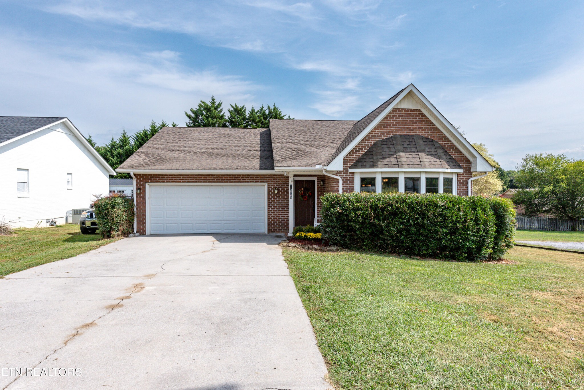 1318 Raulston Road Maryville, TN 37803 - Photo 28 of 28 a front view of a house with a yard and garage