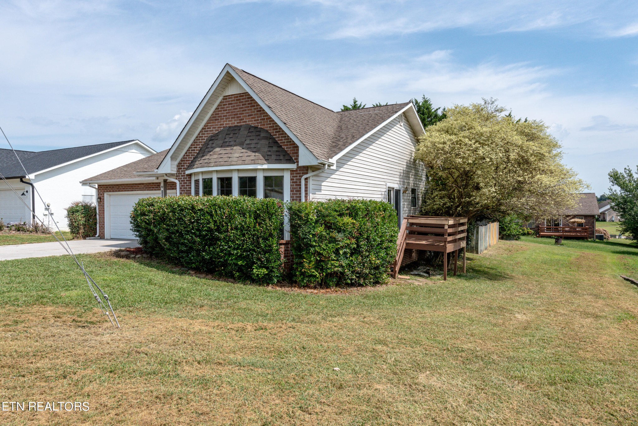 1318 Raulston Road Maryville, TN 37803 - Photo 3 of 28 a front view of a house with a yard