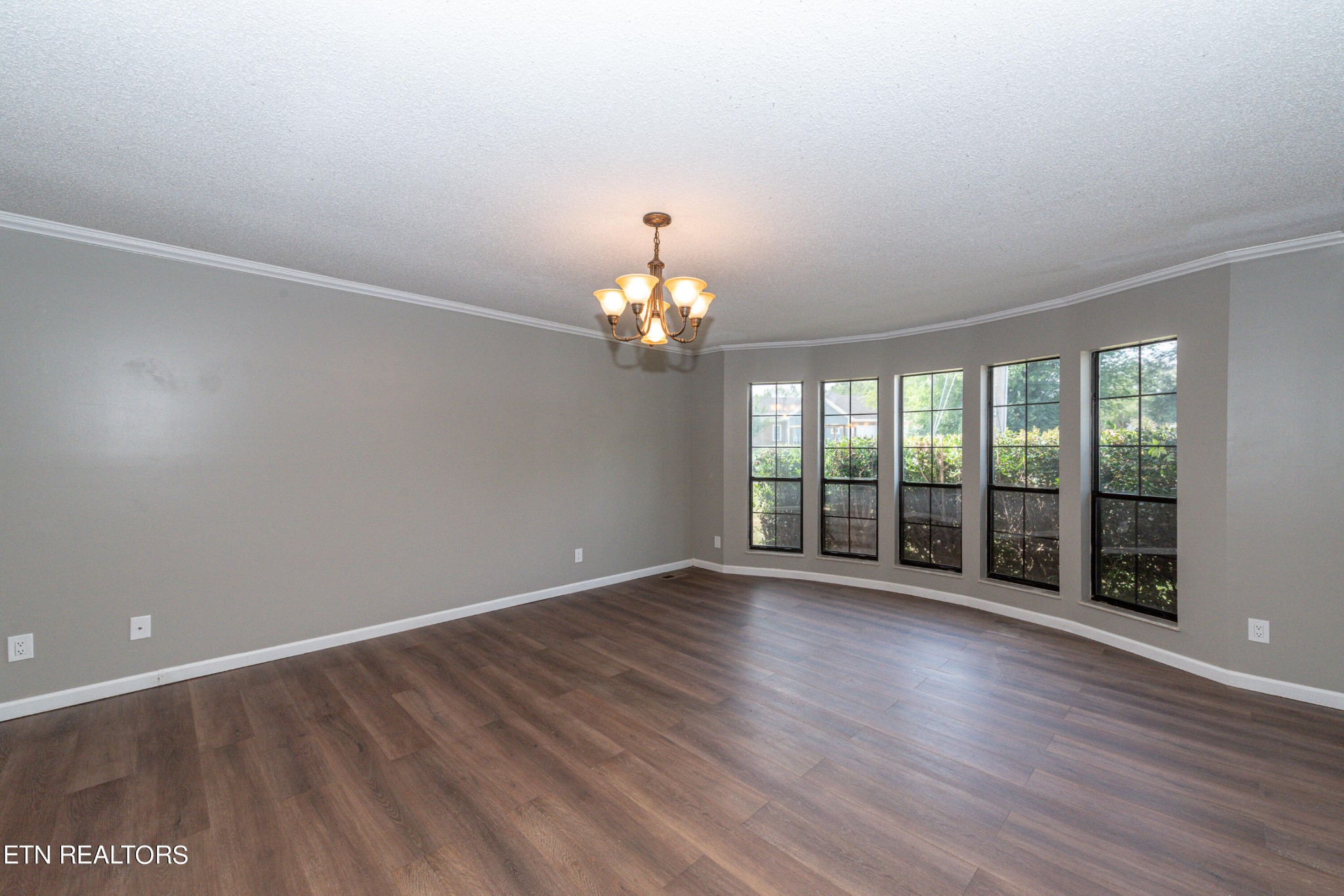 1318 Raulston Road Maryville, TN 37803 - Photo 5 of 28 a view of an empty room with wooden floor and a window
