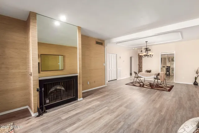 a view of a livingroom with a fireplace and a couch