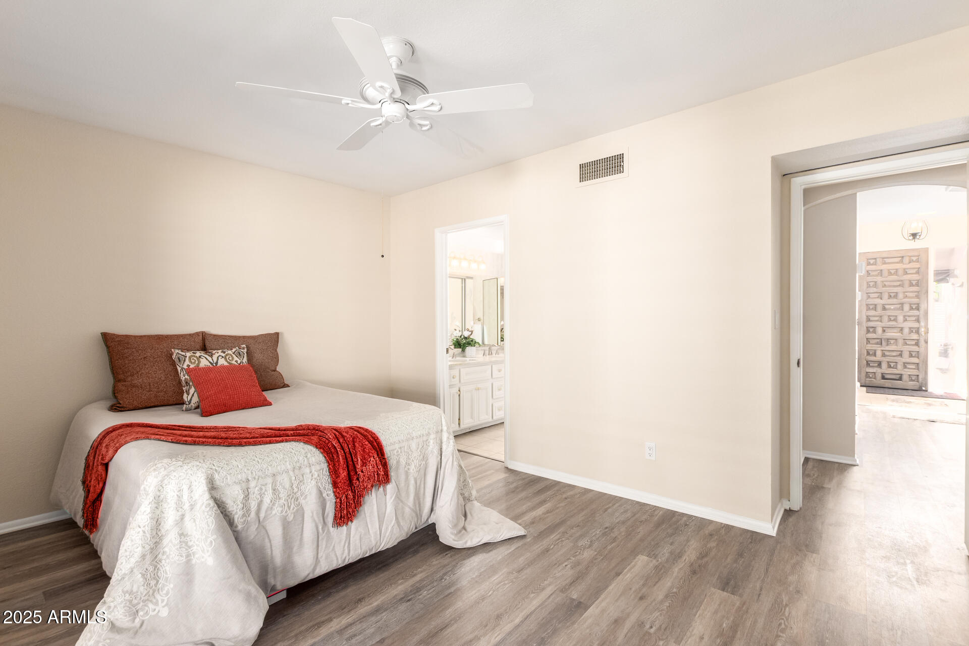 6735 North 16th Place Phoenix, AZ 85016 - Photo 16 of 28 a bedroom with a bed and wooden floor