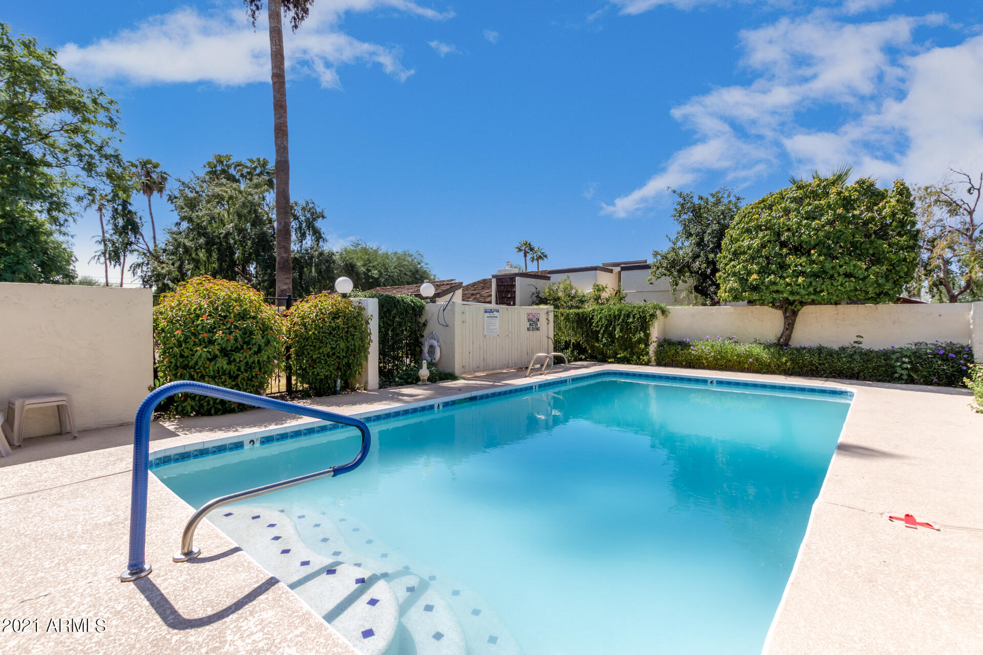 6735 North 16th Place Phoenix, AZ 85016 - Photo 25 of 28 a view of a swimming pool with a yard