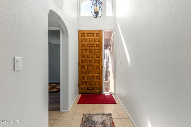 a view of an entryway with wooden floor