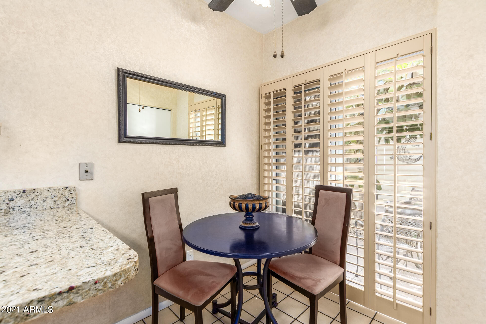 6735 North 16th Place Phoenix, AZ 85016 - Photo 4 of 28 a view of a dining room with furniture and wooden floor