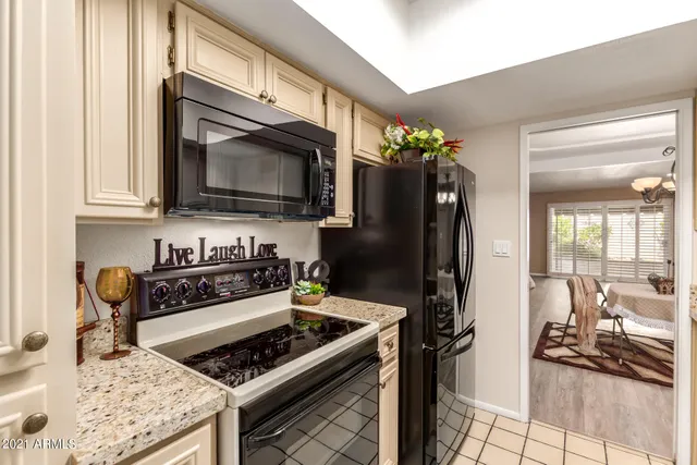 a kitchen with a stove and a refrigerator