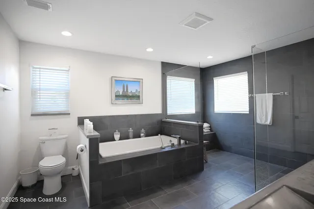 a bathroom with a bathtub sink and toilet