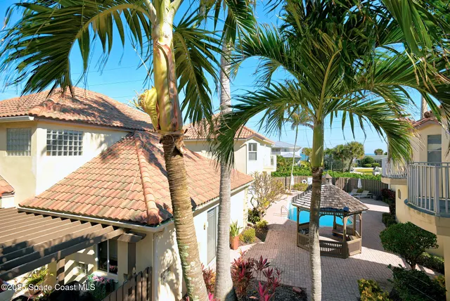 a view of multiple houses with a street