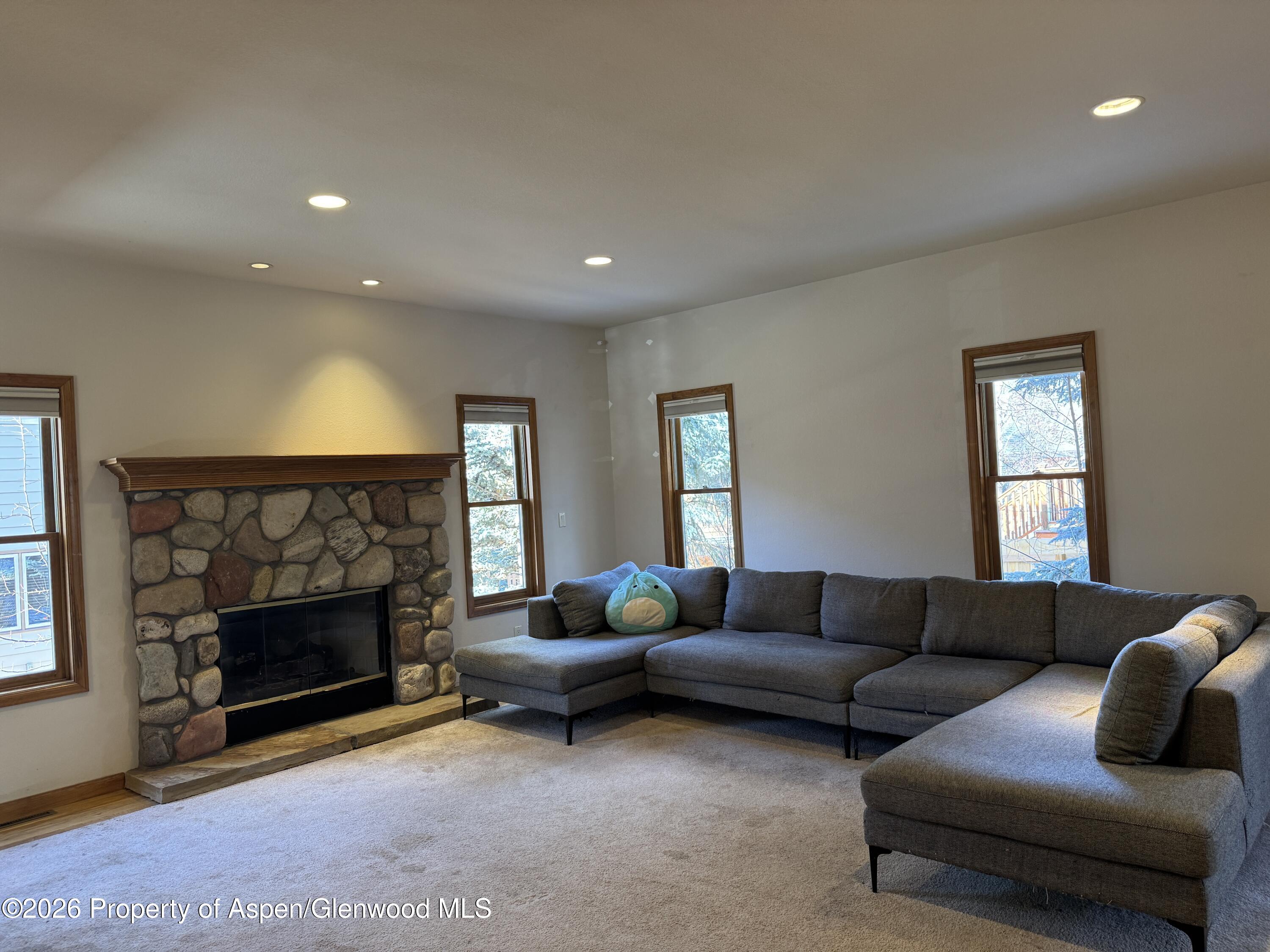 740 Hearthstone Drive Basalt, CO 81621 - Photo 3 of 14 a living room with furniture and a fireplace