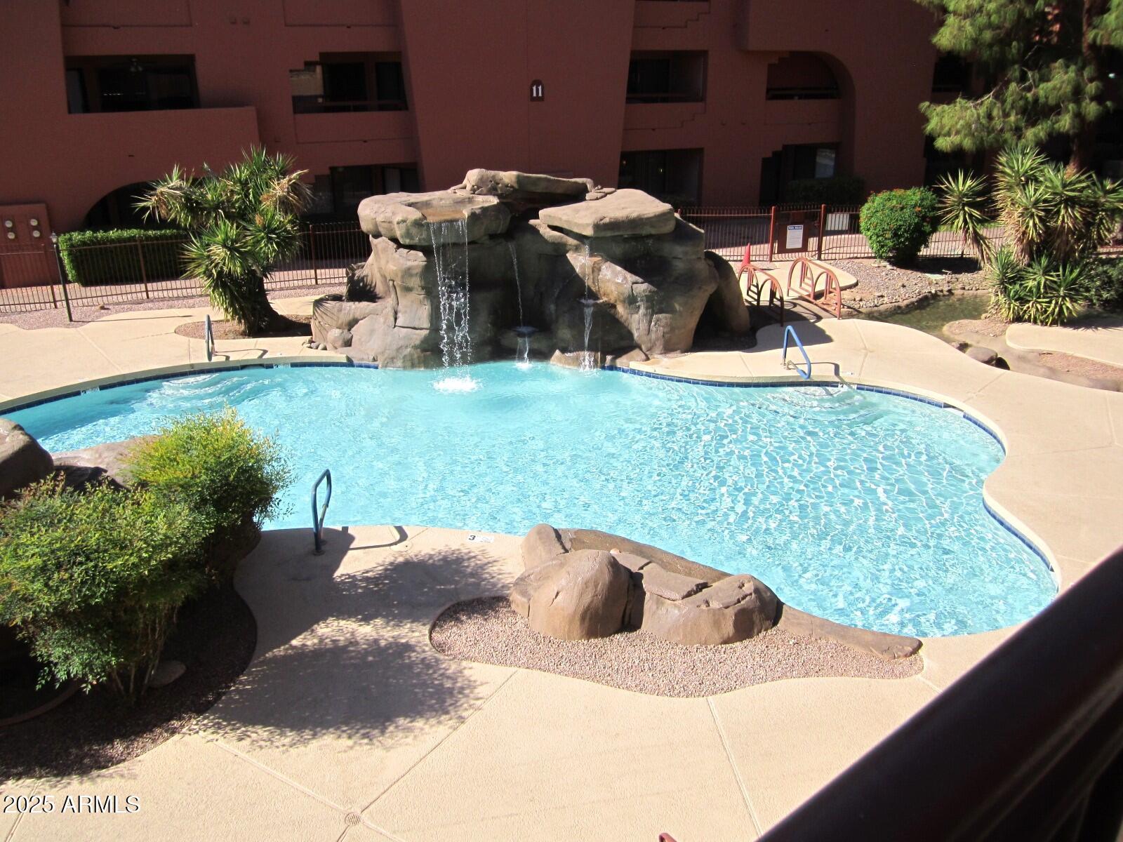 4303 East Cactus Road, Unit 116 Phoenix, AZ 85032 - Photo 34 of 35 a view of a backyard with sitting area