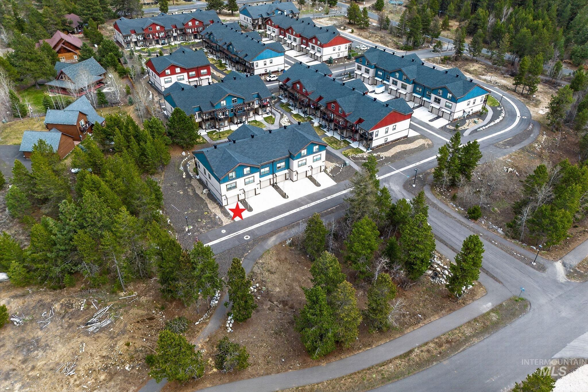 311 Broken Ridge Way McCall, ID 83638 - Photo 2 of 44 Modern townhome community featuring multi-level residences with contrasting siding and dark-pitched roofs