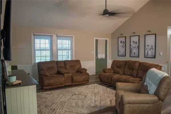 a living room with furniture and a table