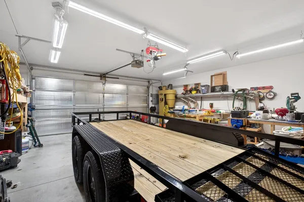 a room with lots of wooden furniture and a flat screen tv