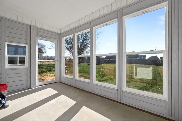 a view of a balcony with wooden floor