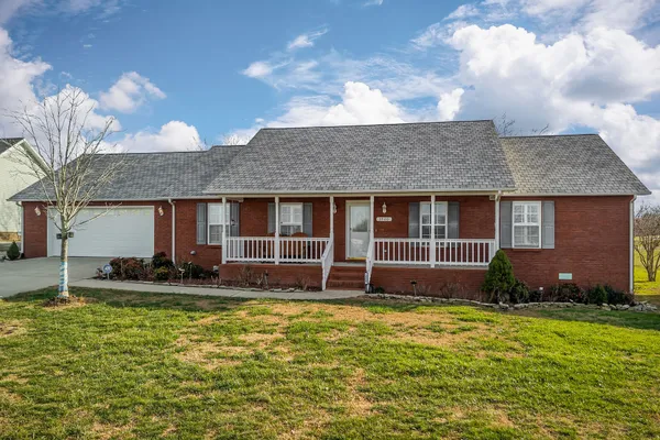 a house view with a garden space