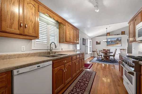 a kitchen with lots of counter top space a sink and appliances