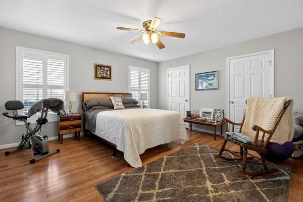 a bedroom with a bed and a chandelier