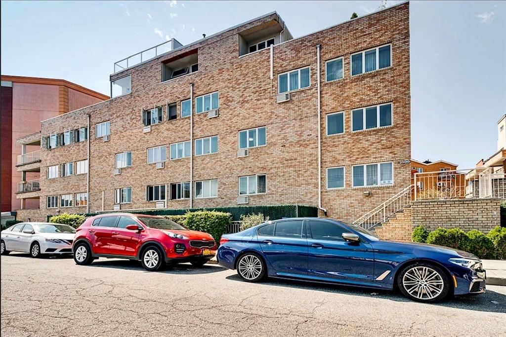 2900 East 29th Street, Unit 2E Brooklyn, NY 11235 - Photo 15 of 17 a car parked in front of a house