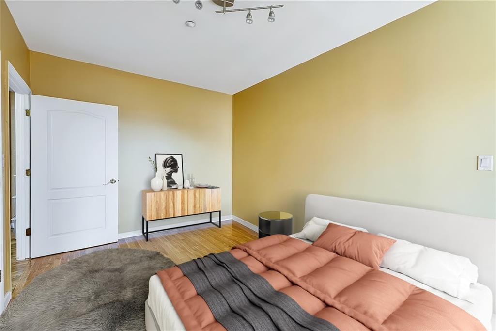 2900 East 29th Street, Unit 2E Brooklyn, NY 11235 - Photo 6 of 17 a bedroom with a bed and dresser