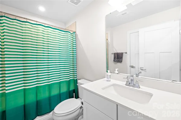 a bathroom with a sink a toilet and tub