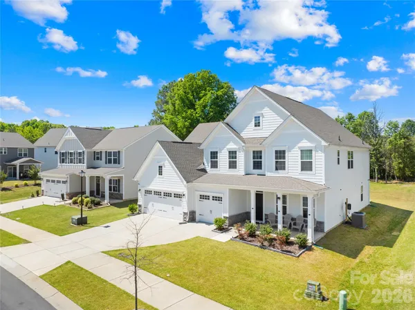 a view of house with yard outdoor seating and entertaining space